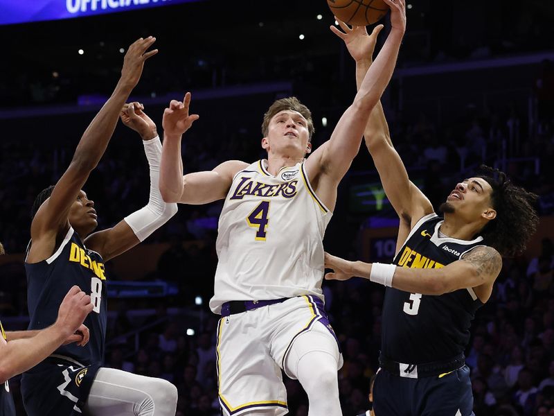 LOS ANGELES, CALIFORNIA - NOVEMBER 23:  Dalton Knecht #4 of the Los Angeles Lakers takes a shot against Peyton Watson #8 and Julian Strawther #3 of the Denver Nuggets in the second half at Crypto.com Arena on November 23, 2024 in Los Angeles, California.  NOTE TO USER: User expressly acknowledges and agrees that, by downloading and/or using this photograph, user is consenting to the terms and conditions of the Getty Images License Agreement. (Photo by Ronald Martinez/Getty Images)