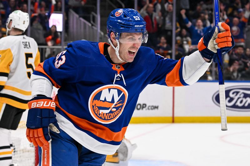 Apr 17, 2024; Elmont, New York, USA;  New York Islanders center Casey Cizikas (53) celebrates his goal against the Pittsburgh Penguins during the second period at UBS Arena. Mandatory Credit: Dennis Schneidler-USA TODAY Sports