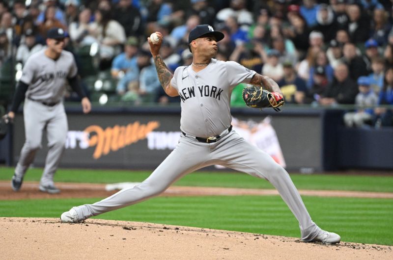 Apr 26, 2024; Milwaukee, Wisconsin, USA; New York Yankees pitcher Luis Gil (81) delivers a pitch against Milwaukee Brewers in the second inning at American Family Field. Mandatory Credit: Michael McLoone-USA TODAY Sports