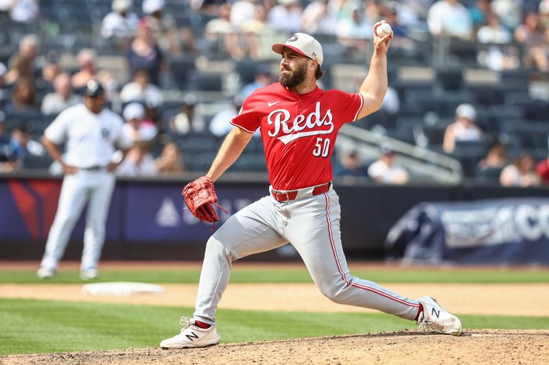 Jul 4, 2024; Bronx, New York, USA; Cincinnati Reds relief pitcher Sam Moll (50) pitches in the ninth inning against the New York Yankees at Yankee Stadium. Mandatory Credit: Wendell Cruz-USA TODAY Sports