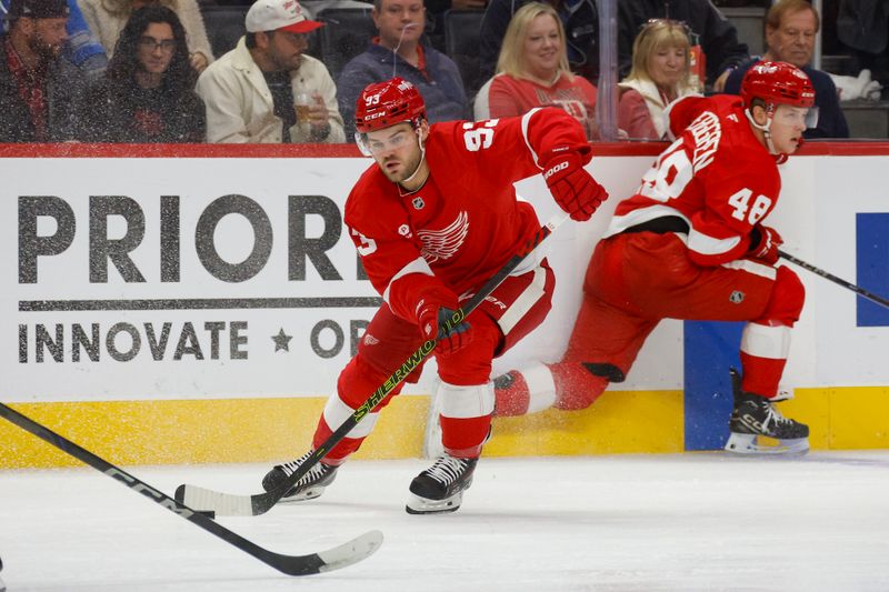 Oct 27, 2024; Detroit, Michigan, USA; Detroit Red Wings right wing Alex DeBrincat (93) handles the puck during the second period at Little Caesars Arena. Mandatory Credit: Brian Bradshaw Sevald-Imagn Images