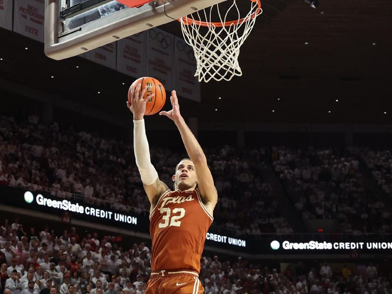 Jan 17, 2023; Ames, Iowa, USA; Texas Longhorns forward Christian Bishop (32) scores against the Iowa State Cyclones during the second half at James H. Hilton Coliseum. Mandatory Credit: Reese Strickland-USA TODAY Sports