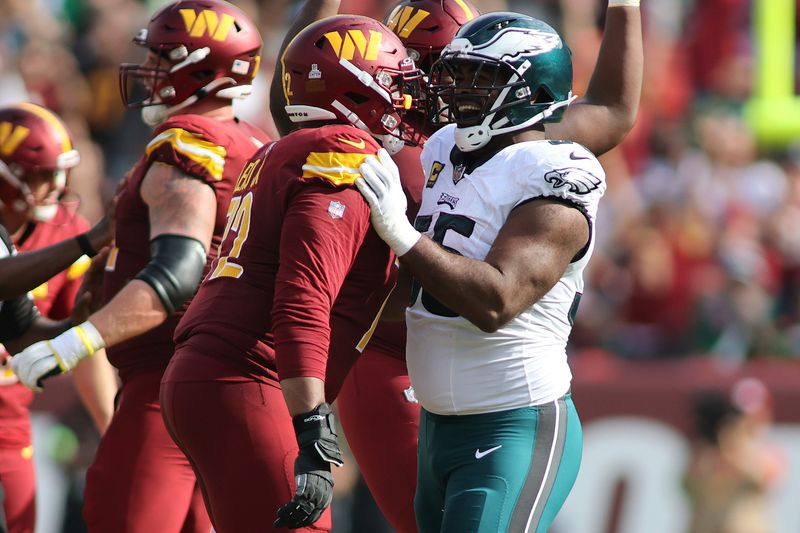 Philadelphia Eagles defensive end Brandon Graham (55) interacts with Washington Commanders offensive tackle Charles Leno Jr. (72) during an NFL football game, Sunday, October 29, 2023 in Landover, Maryland. (AP Photo/Daniel Kucin Jr.)