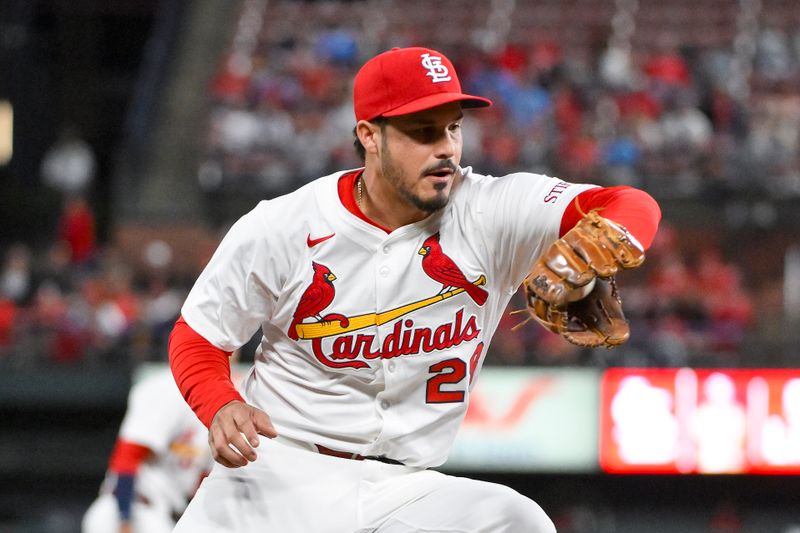 May 6, 2025; St. Louis, Missouri, USA; St. Louis Cardinals third baseman Nolan Arenado (28) fields a ground ball against the Pittsburgh Pirates during the sixth inning at Busch Stadium. Mandatory Credit: Jeff Curry-Imagn Images