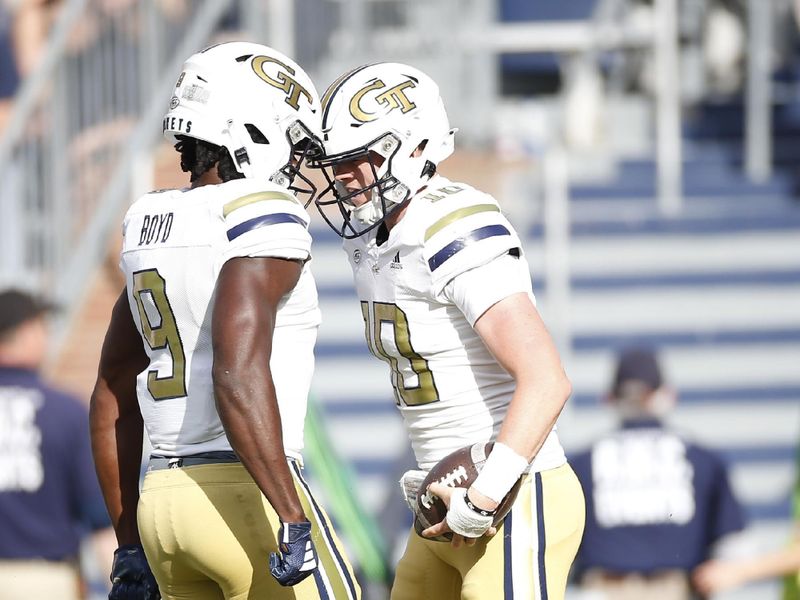 Nov 4, 2023; Charlottesville, Virginia, USA; Georgia Tech Yellow Jackets quarterback Haynes King (10) celebrates with Georgia Tech Yellow Jackets wide receiver Avery Boyd (9) after scoring a touchdown against the Virginia Cavaliers during the first half at Scott Stadium. Mandatory Credit: Amber Searls-USA TODAY Sports