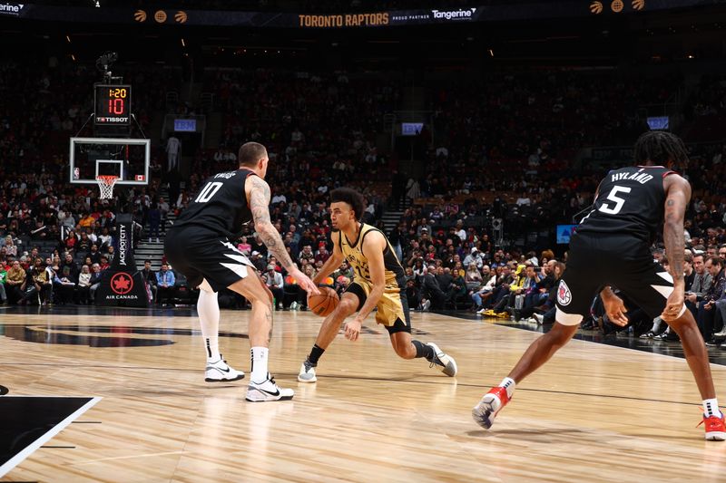 TORONTO, CANADA - JANUARY 26: Jordan Nwora #13 of the Toronto Raptors handles the ball during the game against the LA Clippers on January 26, 2024 at the Scotiabank Arena in Toronto, Ontario, Canada.  NOTE TO USER: User expressly acknowledges and agrees that, by downloading and or using this Photograph, user is consenting to the terms and conditions of the Getty Images License Agreement.  Mandatory Copyright Notice: Copyright 2024 NBAE (Photo by Vaughn Ridley/NBAE via Getty Images)