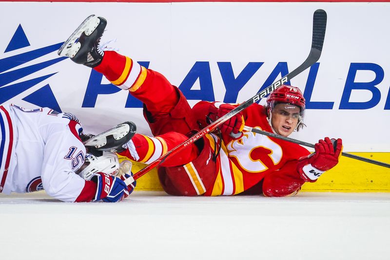 Mar 16, 2024; Calgary, Alberta, CAN; Calgary Flames center Martin Pospisil (76) and Montreal Canadiens center Alex Newhook (15) collides during the third period at Scotiabank Saddledome. Mandatory Credit: Sergei Belski-USA TODAY Sports