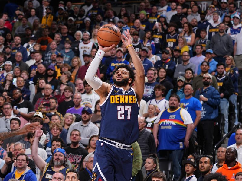 DENVER, CO - APRIL 10: Jamal Murray #27 of the Denver Nuggets shoots a three point basket during the game against the Minnesota Timberwolves on April 10, 2024 at the Ball Arena in Denver, Colorado. NOTE TO USER: User expressly acknowledges and agrees that, by downloading and/or using this Photograph, user is consenting to the terms and conditions of the Getty Images License Agreement. Mandatory Copyright Notice: Copyright 2024 NBAE (Photo by Bart Young/NBAE via Getty Images)