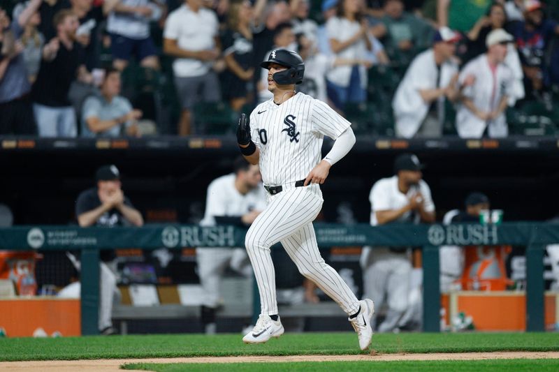 Jun 3, 2025; Chicago, Illinois, USA; Chicago White Sox first baseman Miguel Vargas (20) runs to score against the Detroit Tigers during the seventh inning at Rate Field. Mandatory Credit: Kamil Krzaczynski-Imagn Images