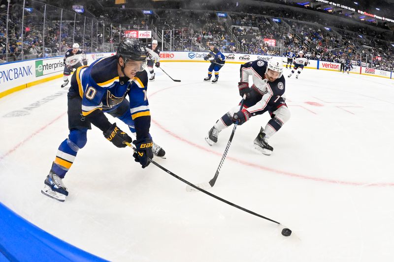 Oct 1, 2024; St. Louis, Missouri, USA;  St. Louis Blues center Brayden Schenn (10) and Columbus Blue Jackets center Sean Kuraly (7) battle for the puck during the second period at Enterprise Center. Mandatory Credit: Jeff Curry-Imagn Images