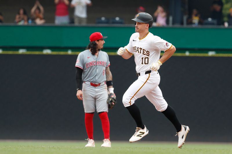 Jun 19, 2024; Pittsburgh, Pennsylvania, USA;  Pittsburgh Pirates left fielder Bryan Reynolds (10) circles the bases on a solo home run against the Cincinnati Reds during the eighth inning at PNC Park. The Pirates shutout the Reds 1-0. Mandatory Credit: Charles LeClaire-USA TODAY Sports