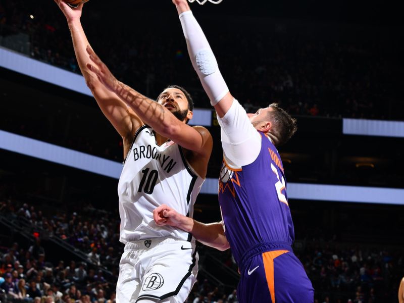 PHOENIX, AZ - NOVEMBER 27: Ben Simmons #10 of the Brooklyn Nets drives to the basket during the game against the Phoenix Suns on November 27, 2024 at Footprint Center in Phoenix, Arizona. NOTE TO USER: User expressly acknowledges and agrees that, by downloading and or using this photograph, user is consenting to the terms and conditions of the Getty Images License Agreement. Mandatory Copyright Notice: Copyright 2024 NBAE (Photo by Barry Gossage/NBAE via Getty Images)