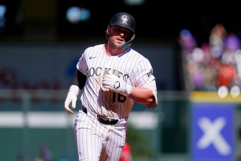 Sep 21, 2025; Denver, Colorado, USA; Colorado Rockies first base Blaine Crim (16) runs off a solo home run in the fourth inning against the Los Angeles Angels at Coors Field. Mandatory Credit: Ron Chenoy-Imagn Images