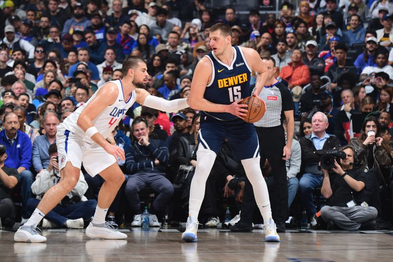 LOS ANGELES, CA - APRIL 4: Nikola Jokic #15 of the Denver Nuggets handles the ball during the game against the Denver Nuggets on April 4, 2024 at Crypto.Com Arena in Los Angeles, California. NOTE TO USER: User expressly acknowledges and agrees that, by downloading and/or using this Photograph, user is consenting to the terms and conditions of the Getty Images License Agreement. Mandatory Copyright Notice: Copyright 2024 NBAE (Photo by Adam Pantozzi/NBAE via Getty Images)