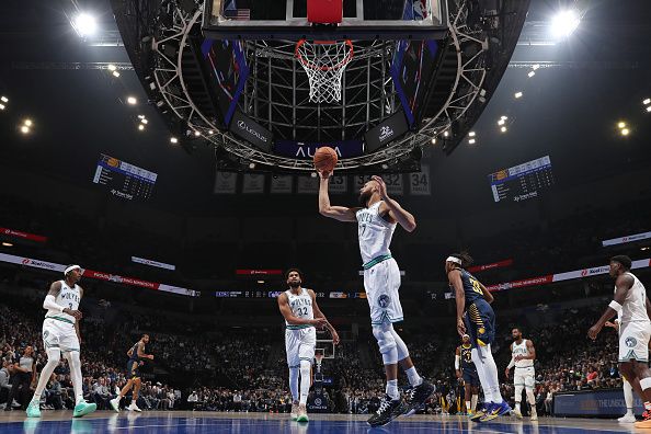 MINNEAPOLIS, MN -  DECEMBER 16: Rudy Gobert #27 of the Minnesota Timberwolves rebounds during the game against the Indiana Pacers on December 16, 2023 at Target Center in Minneapolis, Minnesota. NOTE TO USER: User expressly acknowledges and agrees that, by downloading and or using this Photograph, user is consenting to the terms and conditions of the Getty Images License Agreement. Mandatory Copyright Notice: Copyright 2023 NBAE (Photo by Jordan Johnson/NBAE via Getty Images)