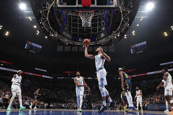 MINNEAPOLIS, MN -  DECEMBER 16: Rudy Gobert #27 of the Minnesota Timberwolves rebounds during the game against the Indiana Pacers on December 16, 2023 at Target Center in Minneapolis, Minnesota. NOTE TO USER: User expressly acknowledges and agrees that, by downloading and or using this Photograph, user is consenting to the terms and conditions of the Getty Images License Agreement. Mandatory Copyright Notice: Copyright 2023 NBAE (Photo by Jordan Johnson/NBAE via Getty Images)