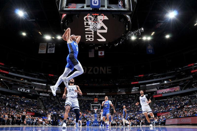 ORLANDO, FL - MARCH 30: Anthony Black #0 of the Orlando Magic dunks the ball during the game against the Memphis Grizzlies on March 30, 2024 at the Kia Center in Orlando, Florida. NOTE TO USER: User expressly acknowledges and agrees that, by downloading and or using this photograph, User is consenting to the terms and conditions of the Getty Images License Agreement. Mandatory Copyright Notice: Copyright 2024 NBAE (Photo by Fernando Medina/NBAE via Getty Images)