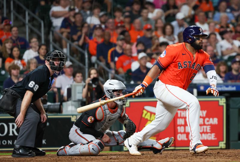 Jun 21, 2024; Houston, Texas, USA; Houston Astros first baseman Jon Singleton (28) hits a single RBI against the Baltimore Orioles in the sixth inning at Minute Maid Park. Mandatory Credit: Thomas Shea-USA TODAY Sports