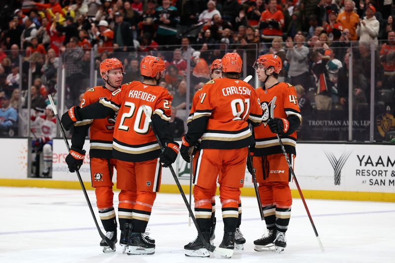 Mar 6, 2026; Anaheim, California, USA;  Anaheim Ducks defenseman Jackson LaCombe (left) celebrates with teammates after scoring a goal during the second period against the Montreal Canadiens at Honda Center. Mandatory Credit: Kiyoshi Mio-Imagn Images