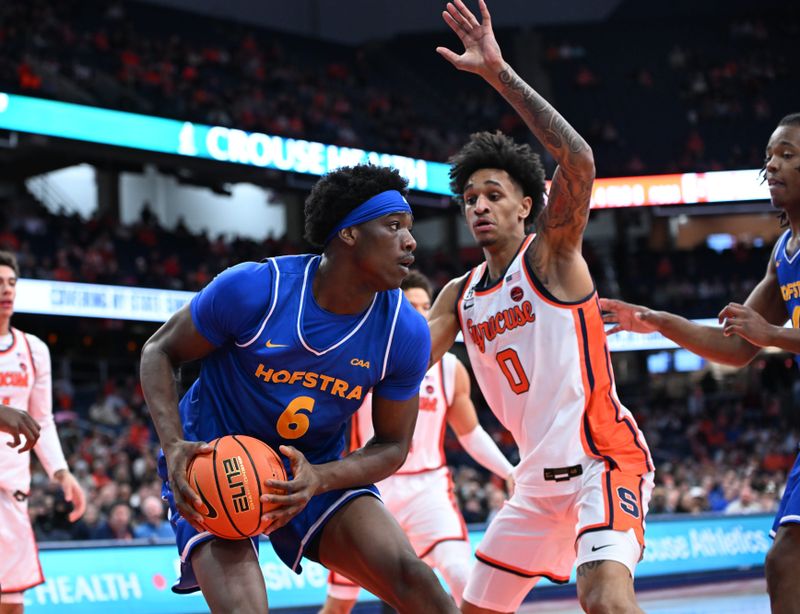 Dec 13, 2025; Syracuse, New York, USA; Hofstra Pride forward Victory Onuetu (6) drives against Syracuse Orange forward Sadiq White Jr. (0) in the first half at the JMA Wireless Dome. Mandatory Credit: Mark Konezny-Imagn Images