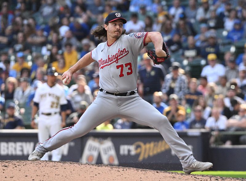 Sep 17, 2023; Milwaukee, Wisconsin, USA; Washington Nationals relief pitcher Hunter Harvey (73) delivers a pitch against the Milwaukee Brewers in the eighth inning at American Family Field. Mandatory Credit: Michael McLoone-USA TODAY Sports