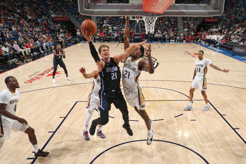 NEW ORLEANS, LA - OCTOBER 7: Moritz Wagner #21 of the Orlando Magic drives to the basket during the game against the New Orleans Pelicans on October 7, 2024 at the Smoothie King Center in New Orleans, Louisiana. NOTE TO USER: User expressly acknowledges and agrees that, by downloading and or using this Photograph, user is consenting to the terms and conditions of the Getty Images License Agreement. Mandatory Copyright Notice: Copyright 2024 NBAE (Photo by Layne Murdoch Jr./NBAE via Getty Images)