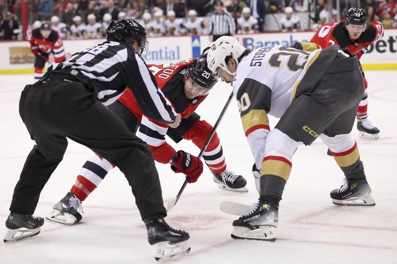 Jan 22, 2024; Newark, New Jersey, USA; New Jersey Devils center Michael McLeod (20) faces off against Vegas Golden Knights center Chandler Stephenson (20) during the first period at Prudential Center. Mandatory Credit: Vincent Carchietta-USA TODAY Sports