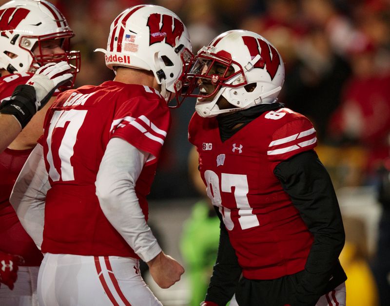 Nov 9, 2019; Madison, WI, USA; Wisconsin Badgers wide receiver Quintez Cephus (87) celebrates with quarterback Jack Coan (17) after scoring a touchdown during the third quarter against the Iowa Hawkeyes at Camp Randall Stadium. Mandatory Credit: Jeff Hanisch-USA TODAY Sports