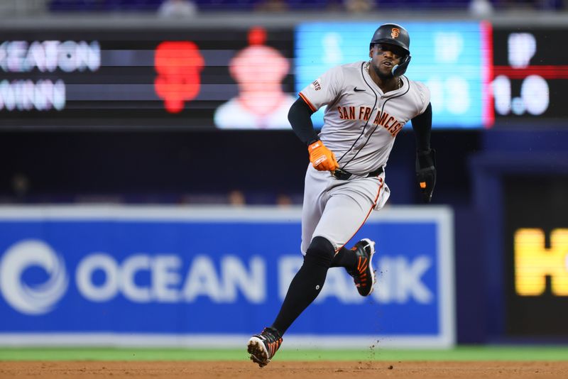 Apr 17, 2024; Miami, Florida, USA; San Francisco Giants designated hitter Jorge Soler (2) runs toward home plate after an RBI double by second baseman Thairo Estrada (not pictured) during the second inning at loanDepot Park. Mandatory Credit: Sam Navarro-USA TODAY Sports