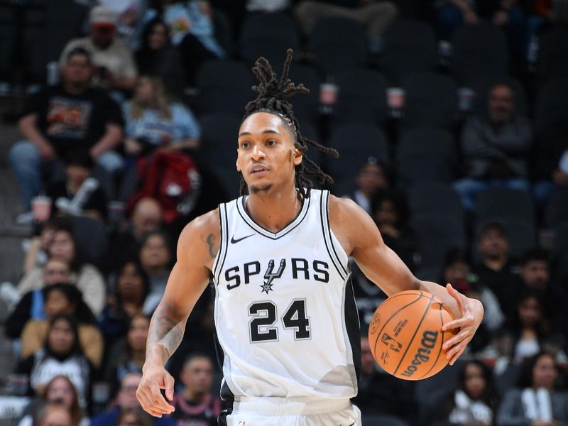 SAN ANTONIO, TX - JANUARY 17: Devin Vassell #24 of the San Antonio Spurs dribbles the ball during the game against the Memphis Grizzlies on January 17, 2025 at the Frost Bank Center in San Antonio, Texas. NOTE TO USER: User expressly acknowledges and agrees that, by downloading and or using this photograph, user is consenting to the terms and conditions of the Getty Images License Agreement. Mandatory Copyright Notice: Copyright 2025 NBAE (Photos by Michael Gonzales/NBAE via Getty Images)