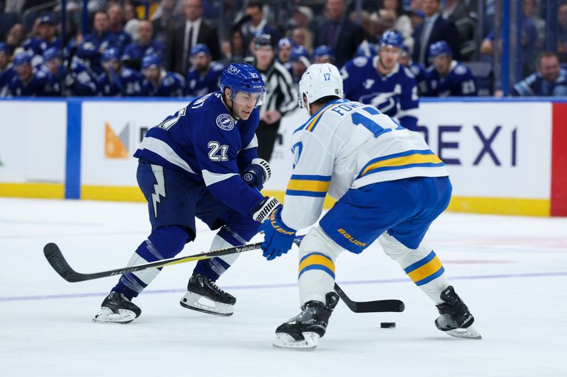 Dec 22, 2025; Tampa, Florida, USA; Tampa Bay Lightning center Brayden Point (21) controls the puck from St. Louis Blues defenseman Cam Fowler (17) in the third period at Benchmark International Arena. Mandatory Credit: Nathan Ray Seebeck-Imagn Images