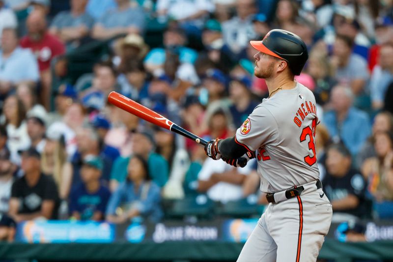 Jul 3, 2024; Seattle, Washington, USA; Baltimore Orioles first baseman Ryan O'Hearn (32) hits a solo-home run against the Seattle Mariners during the fifth inning at T-Mobile Park. Mandatory Credit: Joe Nicholson-USA TODAY Sports