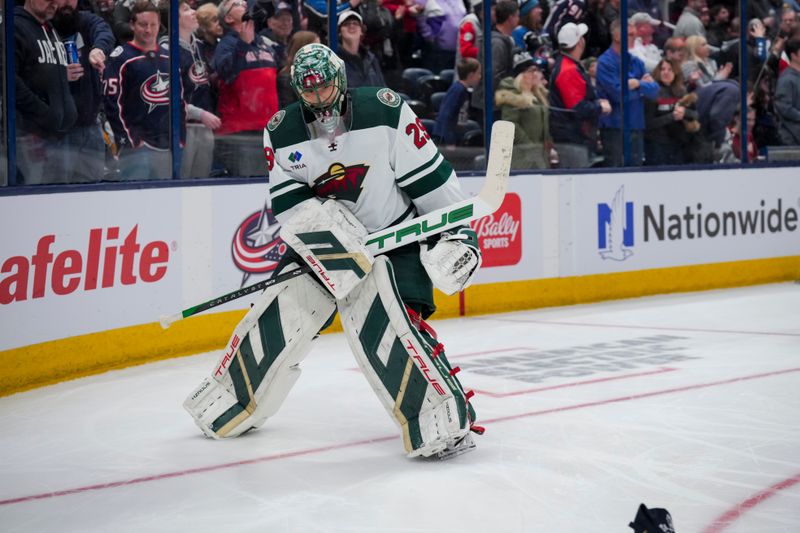 Jan 6, 2024; Columbus, Ohio, USA;  Minnesota Wild goaltender Marc-Andre Fleury (29) knocks a hat off the ice after Columbus Blue Jackets center Cole Sillinger (4) scores a hat-trick goal in the third period at Nationwide Arena. Mandatory Credit: Aaron Doster-USA TODAY Sports