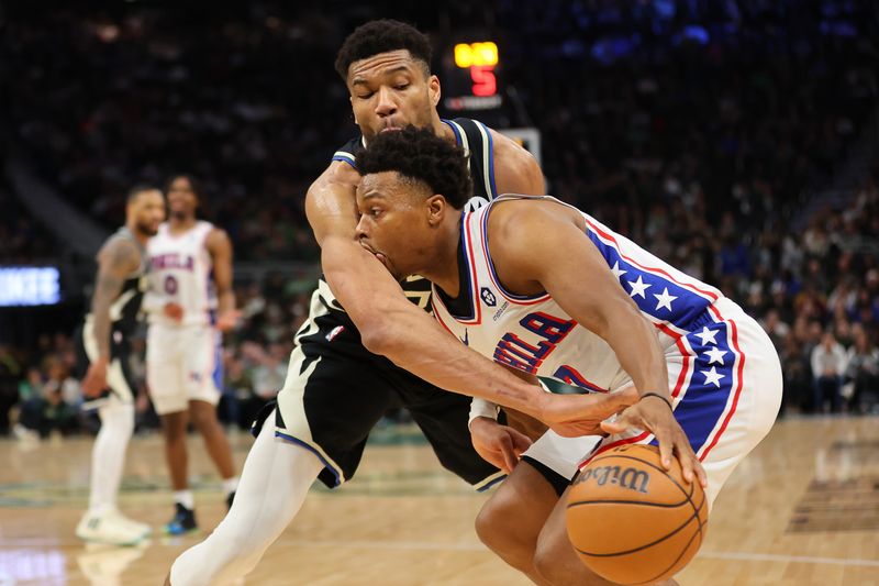 MILWAUKEE, WISCONSIN - MARCH 14: Kyle Lowry #7 of the Philadelphia 76ers is fouled by Giannis Antetokounmpo #34 of the Milwaukee Bucks during the second half of a game at Fiserv Forum on March 14, 2024 in Milwaukee, Wisconsin. NOTE TO USER: User expressly acknowledges and agrees that, by downloading and or using this photograph, User is consenting to the terms and conditions of the Getty Images License Agreement. (Photo by Stacy Revere/Getty Images)