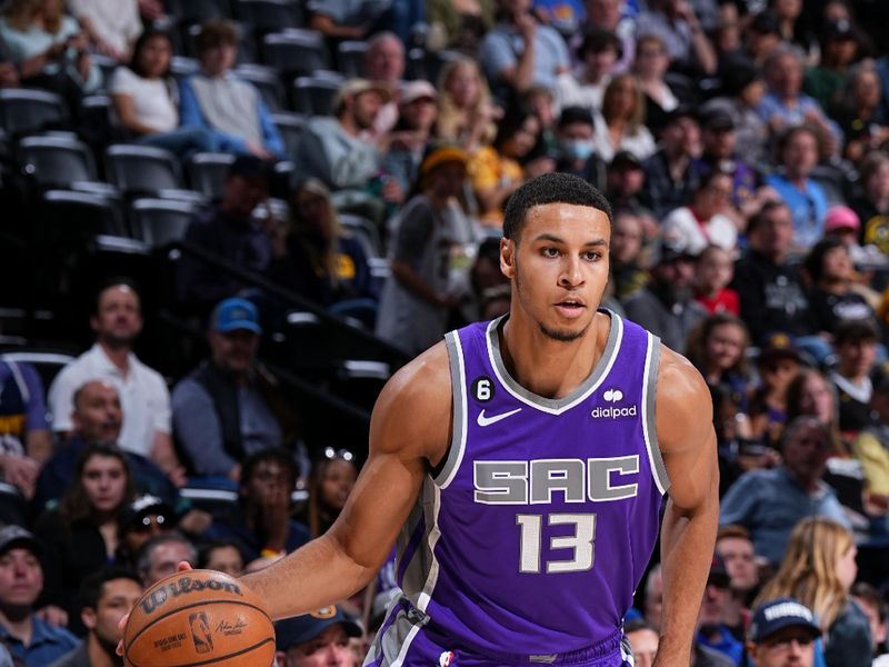 DENVER, CO - APRIL 9: Keegan Murray #13 of the Sacramento Kings dribbles the ball during the game against the Denver Nuggets on April 9, 2023 at the Ball Arena in Denver, Colorado. NOTE TO USER: User expressly acknowledges and agrees that, by downloading and/or using this Photograph, user is consenting to the terms and conditions of the Getty Images License Agreement. Mandatory Copyright Notice: Copyright 2023 NBAE (Photo by Garrett Ellwood/NBAE via Getty Images)