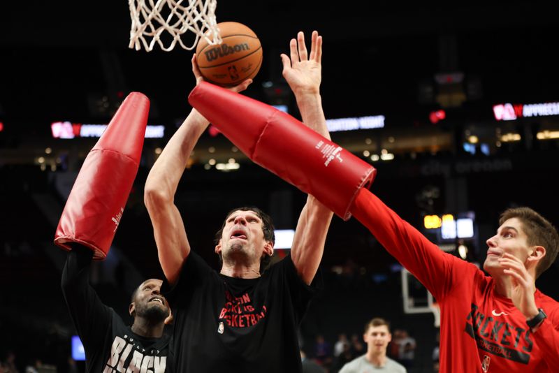 PORTLAND, OREGON - APRIL 12: Boban Marjanovic #51 of the Houston Rockets (2L) warms up before a game against the Portland Trail Blazers at Moda Center on April 12, 2024 in Portland, Oregon. NOTE TO USER: User expressly acknowledges and agrees that, by downloading and or using this photograph, User is consenting to the terms and conditions of the Getty Images License Agreement. (Photo by Amanda Loman/Getty Images)