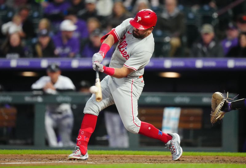 May 12, 2023; Denver, Colorado, USA; Philadelphia Phillies catcher Garrett Stubbs (21) hits a two run home run in the seventh inning against the Colorado Rockies at Coors Field. Mandatory Credit: Ron Chenoy-USA TODAY Sports