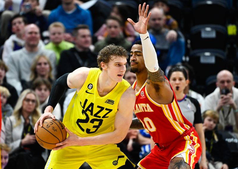 SALT LAKE CITY, UTAH - FEBRUARY 03: John Collins #20 of the Atlanta Hawks defends Lauri Markkanen #23 of the Utah Jazz during the second half of a game at Vivint Arena on February 03, 2023 in Salt Lake City, Utah.  NOTE TO USER: User expressly acknowledges and agrees that, by downloading and or using this photograph, User is consenting to the terms and conditions of the Getty Images License Agreement. (Photo by Alex Goodlett/Getty Images)