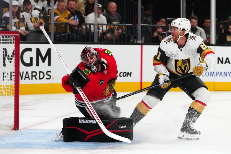 Oct 27, 2023; Las Vegas, Nevada, USA; Chicago Blackhawks goaltender Petr Mrazek (34) makes a save against Vegas Golden Knights right wing Jonathan Marchessault (81) during the first period at T-Mobile Arena. Mandatory Credit: Stephen R. Sylvanie-USA TODAY Sports