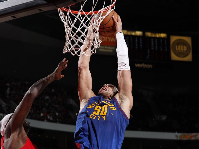 PORTLAND, OR - MARCH 23: Aaron Gordon #50 of the Denver Nuggets dunks the ball during the game against the Portland Trail Blazers on March 23, 2024 at the Moda Center Arena in Portland, Oregon. NOTE TO USER: User expressly acknowledges and agrees that, by downloading and or using this photograph, user is consenting to the terms and conditions of the Getty Images License Agreement. Mandatory Copyright Notice: Copyright 2024 NBAE (Photo by Cameron Browne/NBAE via Getty Images)