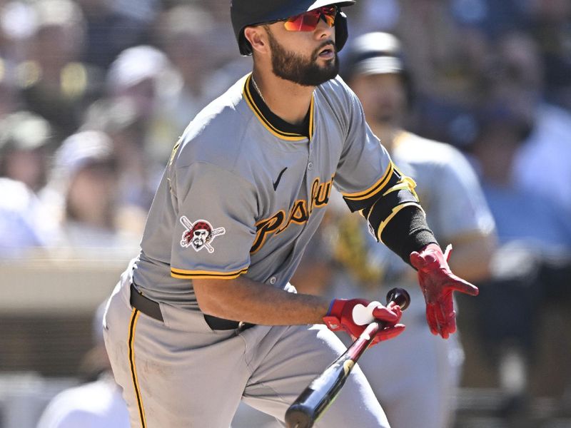 August 14, 2024; San Diego, California, USA; Pittsburgh Pirates third baseman Isiah Kiner-Falefa (7) hits an RBI single against the San Diego Padres during the ninth inning at Petco Park. Mandatory Credit: Denis Poroy-USA TODAY Sports at Petco Park. 