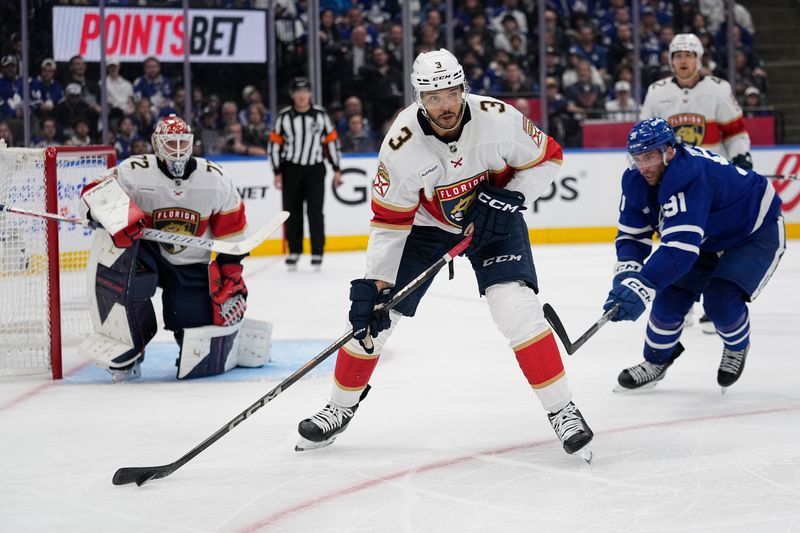 May 5, 2025; Toronto, Ontario, CAN; Florida Panthers defenseman Seth Jones (3) passes against Toronto Maple Leafs forward John Tavares (91) during the third period of the second round of the 2025 Stanley Cup Playoffs at Scotiabank Arena. Mandatory Credit: John E. Sokolowski-Imagn Images