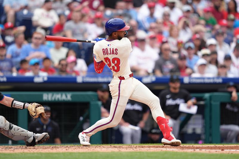 Apr 19, 2025; Philadelphia, Pennsylvania, USA; Philadelphia Phillies outfielder Johan Rojas (23) hits a double against the Miami Marlins in the third inning at Citizens Bank Park. Mandatory Credit: Kyle Ross-Imagn Images
