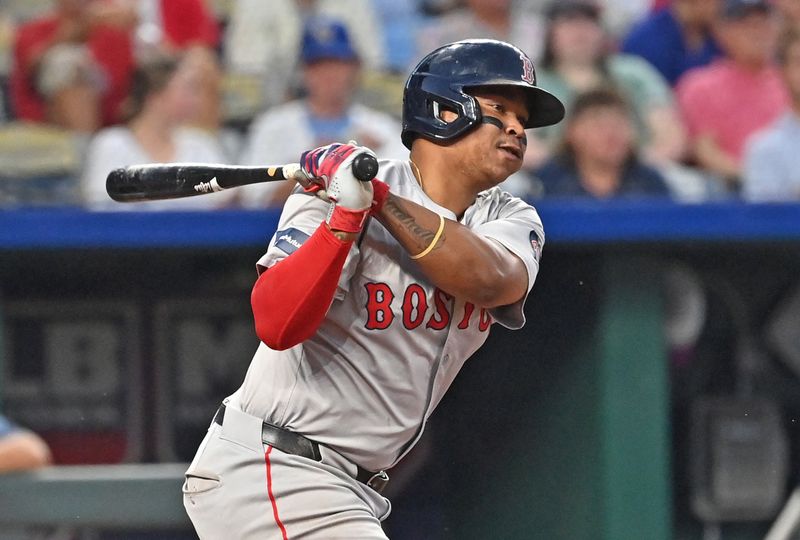 Aug 5, 2024; Kansas City, Missouri, USA;  Boston Red Sox third baseman Rafael Devers (11) singles in the fifth inning against the Kansas City Royals at Kauffman Stadium. Mandatory Credit: Peter Aiken-USA TODAY Sports