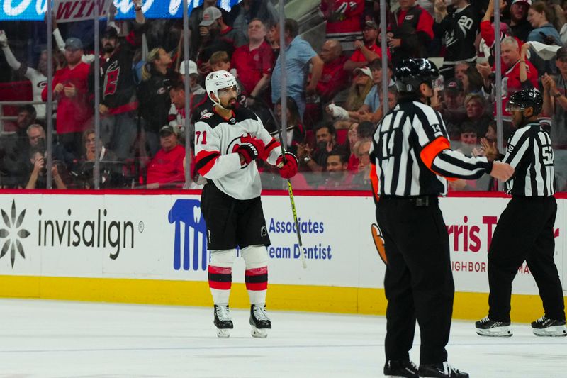 May 11, 2023; Raleigh, North Carolina, USA; New Jersey Devils defenseman Jonas Siegenthaler (71) goes to the penalty box against the Carolina Hurricanes during the overtime in game five of the second round of the 2023 Stanley Cup Playoffs at PNC Arena. Mandatory Credit: James Guillory-USA TODAY Sports