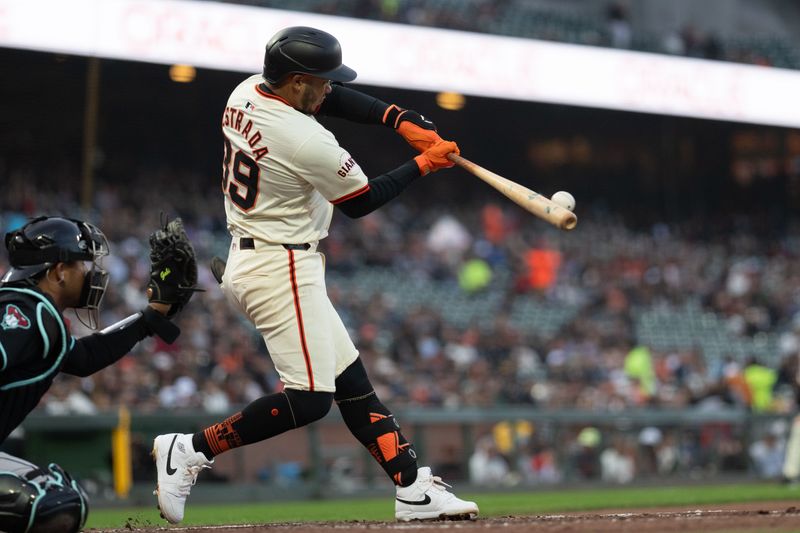 Apr 18, 2024; San Francisco, California, USA;  San Francisco Giants second base Thairo Estrada (39) hits a single during the second inning against the Arizona Diamondbacks at Oracle Park. Mandatory Credit: Stan Szeto-USA TODAY Sports