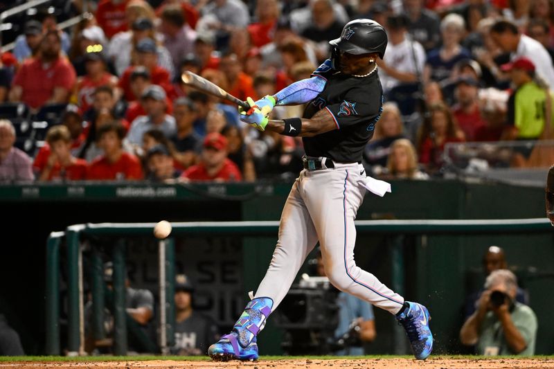 Sep 1, 2023; Washington, District of Columbia, USA; Miami Marlins center fielder Jazz Chisholm Jr. (2) hits a RBI fielders choice against the Washington Nationals during the third inning at Nationals Park. Mandatory Credit: Brad Mills-USA TODAY Sports