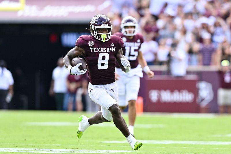 Sep 23, 2023; College Station, Texas, USA; Texas A&M Aggies running back Le'Veon Moss (8) runs the ball during the first half against the Auburn Tigers at Kyle Field. Mandatory Credit: Maria Lysaker-USA TODAY Sports