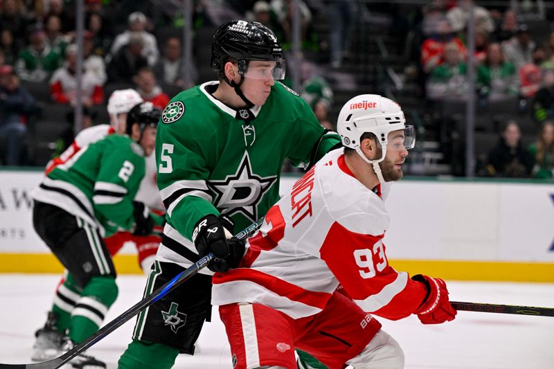 Jan 19, 2025; Dallas, Texas, USA; Dallas Stars defenseman Nils Lundkvist (5) checks Detroit Red Wings right wing Alex DeBrincat (93) during the third period at the American Airlines Center. Mandatory Credit: Jerome Miron-Imagn Images