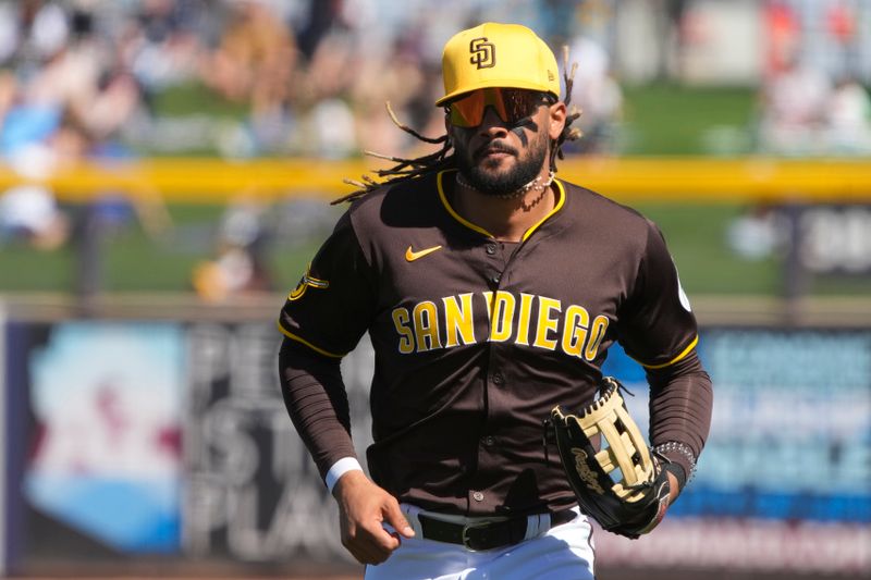 Mar 4, 2024; Peoria, Arizona, USA; San Diego Padres right fielder Fernando Tatis Jr. (23) runs in from the outfield against the Chicago Cubs in the first inning at Peoria Sports Complex. Mandatory Credit: Rick Scuteri-USA TODAY Sports